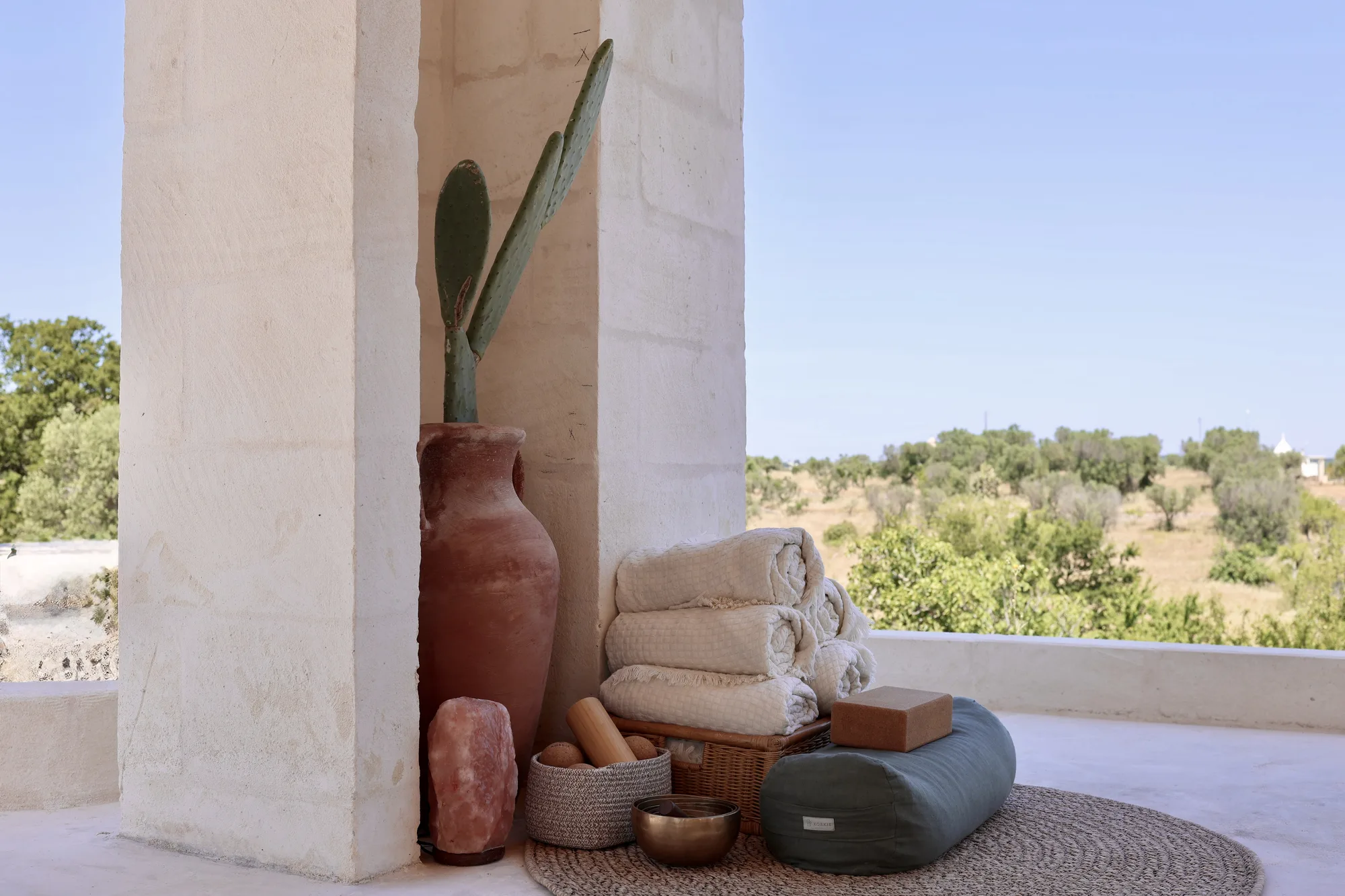 Singing bowl and bolster resting on the portico floor